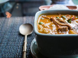 Roasted duck yellow curry traditional Thai dish served with rice