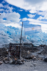 Argentina flag flying in front of Perito Moreno Glacier