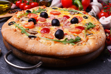 Excellent Italian pizza with cheese and tomatoes, and olives