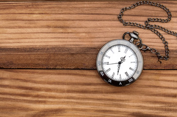 Pocket watch on the table. Top view. Copy space.