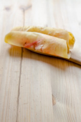 Roti Saimai(Cotton candy) , Thai cotton candy burrito pancake on wooden background
