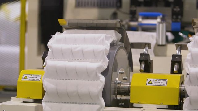 Manufacturing a mattress with automated production line machinery