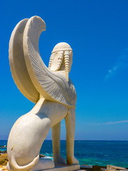 The Naxos (Naxian) Sphinx statue in port of Naxos Island, Cyclades, Greece - obrazy, fototapety, plakaty
