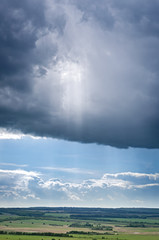 Obraz na płótnie Canvas Vertical Natural Landscape With Large Overcast Clouds.