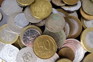 Coins of different countries closeup background