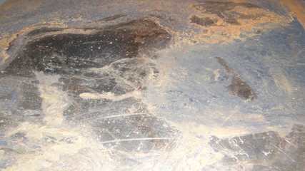 The texture of the metal and rust.