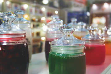 glass jars of jam and jelly for tasting on display