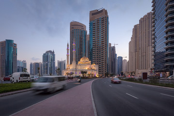 Fototapeta na wymiar Modern skyline with traffic on streets in Dubai Marina