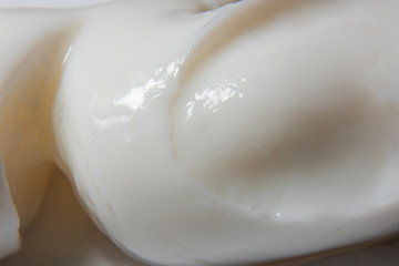 Light not transparent cream with glare macro