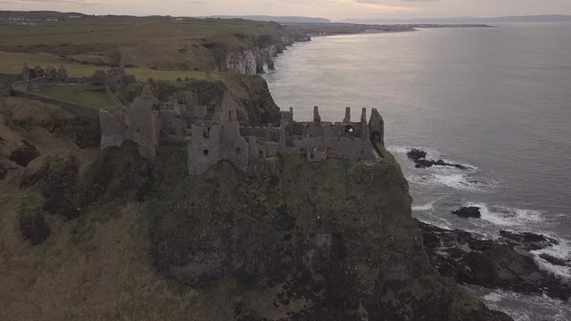 Castle ruins on seaside cliff top Aerial drone shot