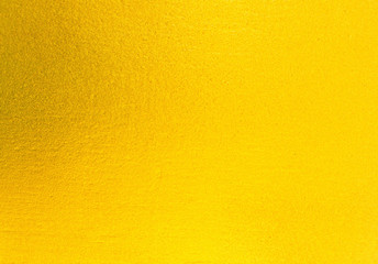 Naklejka premium Shiny yellow leaf gold foil texture background 
