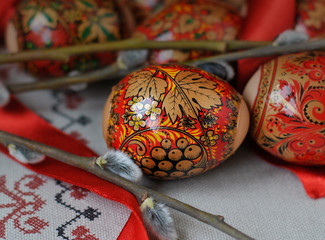 Easter eggs with a pattern and a willow branch. Close-up.