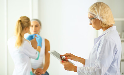 Obraz premium woman getting injection. beauty injections and cosmetology