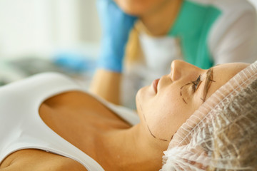 Permanent Makeup For Eyebrows. Beautiful Woman With Thick Brows In Beauty Salon. Beautician Doing Eyebrow Tattooing For Female Face. Beauty Procedure