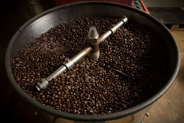 Roasting process of coffee. The freshly roasted coffee beans in the cooling cylinder from top view