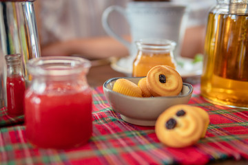 Tea drinking with cookies and muffins