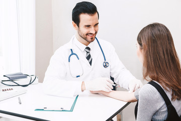 Doctor in protective gloves giving a female patient injection  in hospital.healthcare and medicine