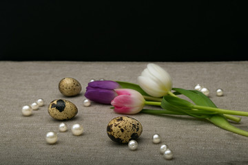 wuail eggs with tulip flowers , easter decoration