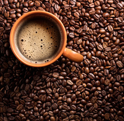 coffee cup on coffee beans background