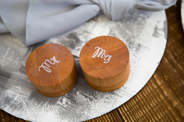 Two round wooden boxes for wedding rings