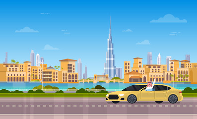 Obraz premium Yellow Taxi Car On Road Over Dubai City Background Flat Vector Illustration
