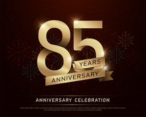 85th years anniversary celebration gold number and golden ribbons with fireworks on dark background. vector illustration