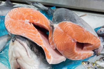 Pieces of fresh Norwegian salmon freshly cut at the fishmonger's counter