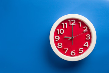 wall clock set on color background. The concept of 