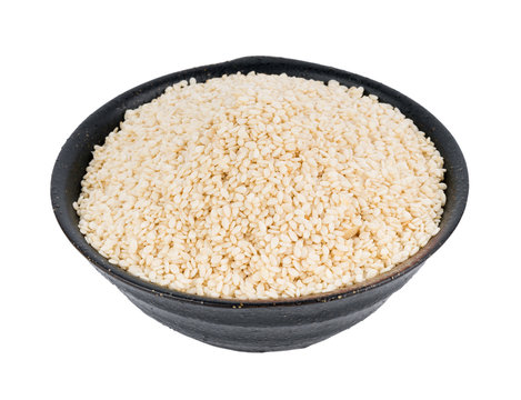 white sesame seed in bowl isolated on white background