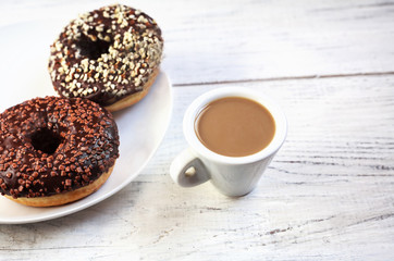 sugar glazed donuts with mug coffee
