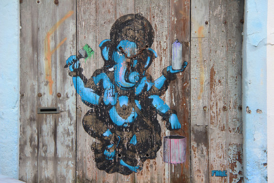 Ganesha painting on a wooden wall