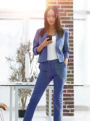 Full length of young businesswoman on Cell Phone