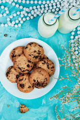 Cookie chocolate with a milk bottles.