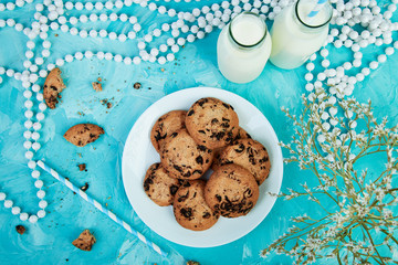 Cookie chocolate with a milk bottles.