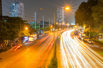 Fototapeta na wymiar Cars light on ratchada road in night time , Bangkok, Thailand