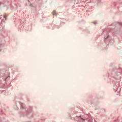 Falling or flying pastel pink flowers background or frame, creative layout with copy space for design