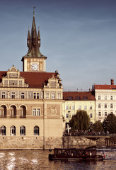Fototapeta na wymiar Sights Of Prague. The chapel of the tower of a European city. The facade of the vintage building