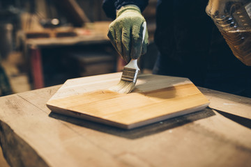 Carpenter working in his woodwork or workshop.