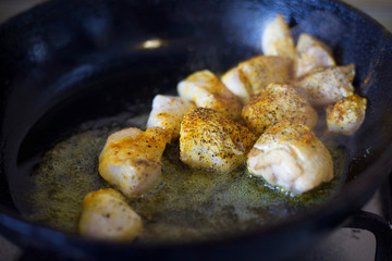 Fry meat in the pan. To cook the sliced meat with seasoning. Cooking meat with spices. 