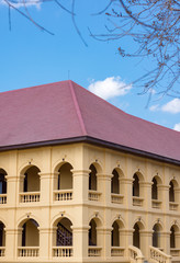 some part of vintage western style building with blue sky
