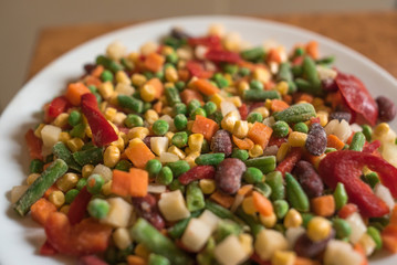 Frozen mexican mix of vegetables assorted on white plate