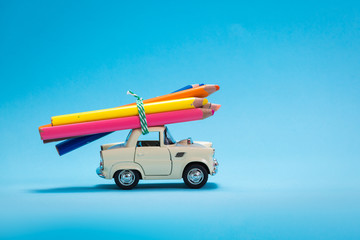 Car toy carrying wooden crayons