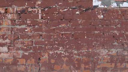 The texture of the brick wall and plaster.