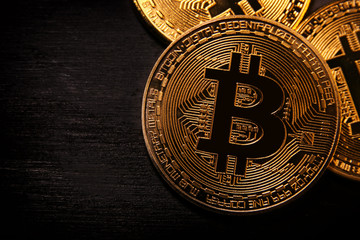 Golden Bitcoin over black background. Business concept.