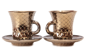 Ancient porcelain tea cups on a white background