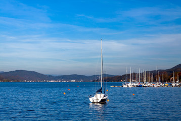 Fototapeta na wymiar Yacht sailing in lake, Lake Wolfgang, Austria