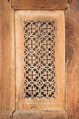 aged perforated teak wood panel, it's traditional work in oriental style