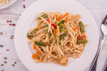 Home-made noodles with vegetables and greens