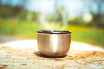 mug with tea in nature