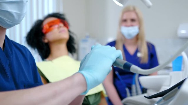 Dentist and his assitant working in private practice.